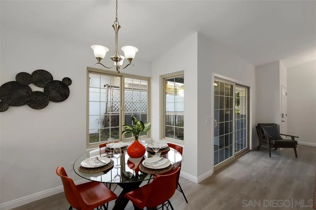 439 Mainsail Road Oceanside, CA 92054 - Photo 8 of 25 a dining room with furniture and a large window