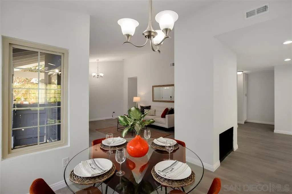 439 Mainsail Road Oceanside, CA 92054 - Photo 9 of 25 a dining room with furniture and wooden floor