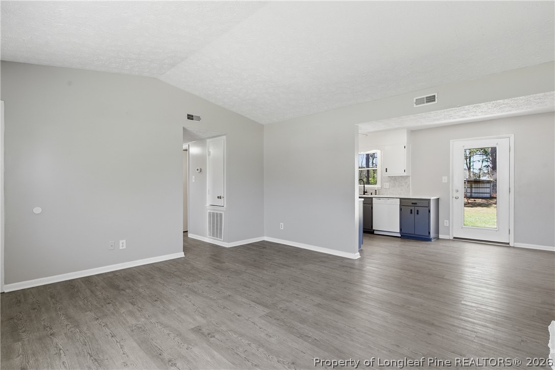 6319 Rustic Ridge Hope Mills, NC 28348 - Photo 10 of 39 an empty room with wooden floor and windows