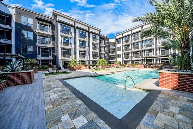 front view of a building with a garden