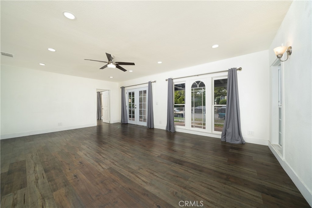 201 South Orange Avenue Santa Ana, CA 92701 - Photo 2 of 6 a view of a livingroom with wooden floor and a ceiling fan