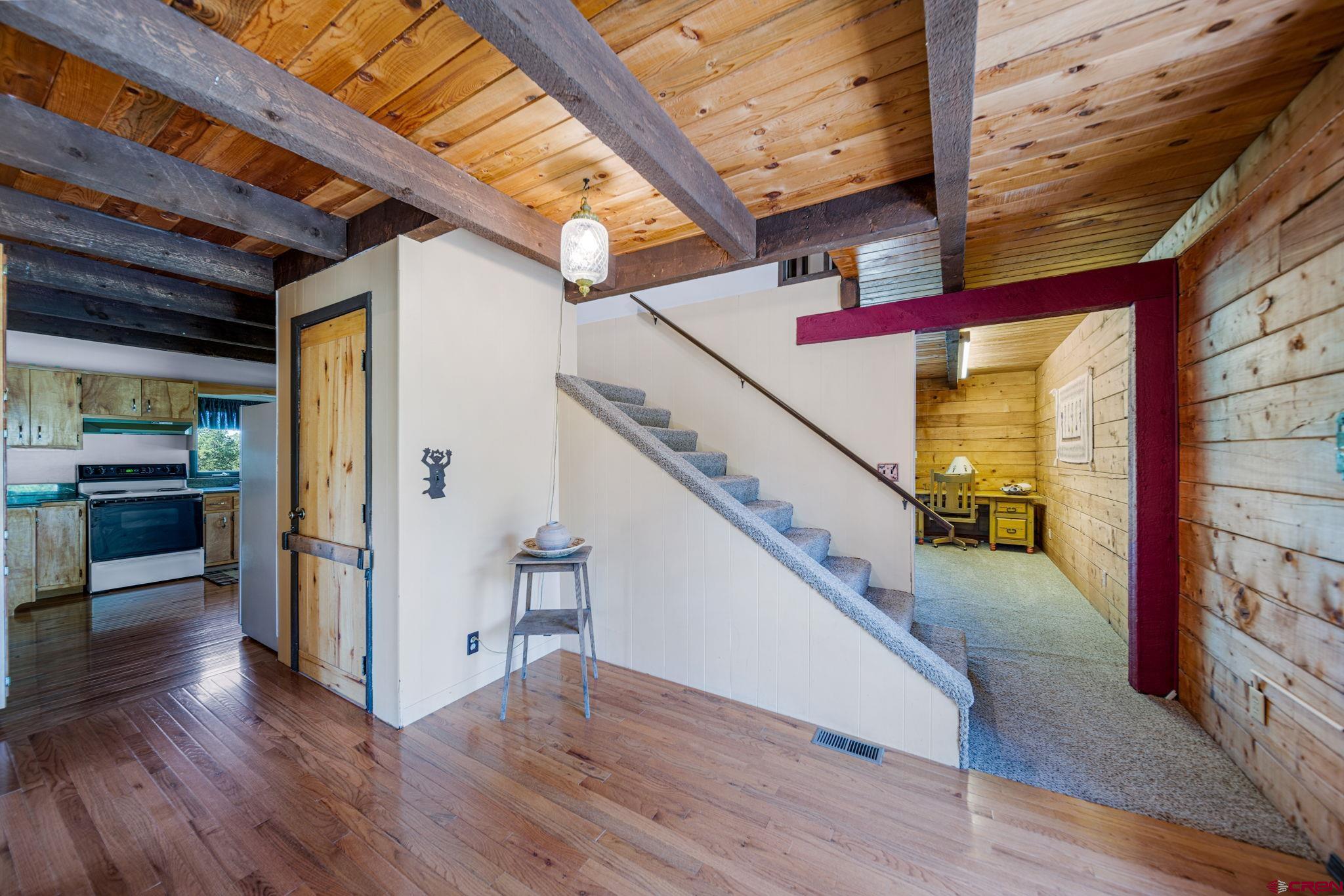 1019 Meadow Road Durango, CO 81303 - Photo 7 of 33 a view of entryway and hall with wooden floor