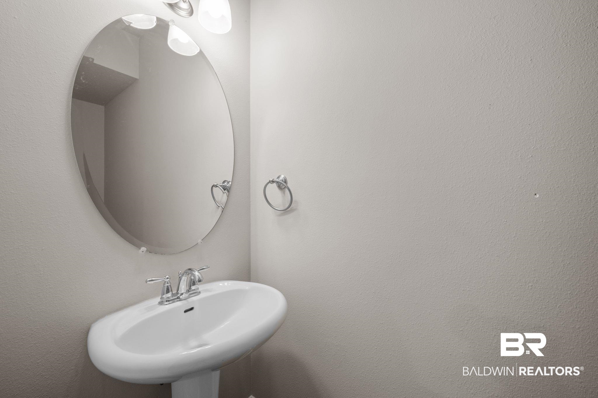 6903 Spaniel Drive, Unit B Spanish Fort, AL 36527 - Photo 11 of 28 Bathroom featuring a sink