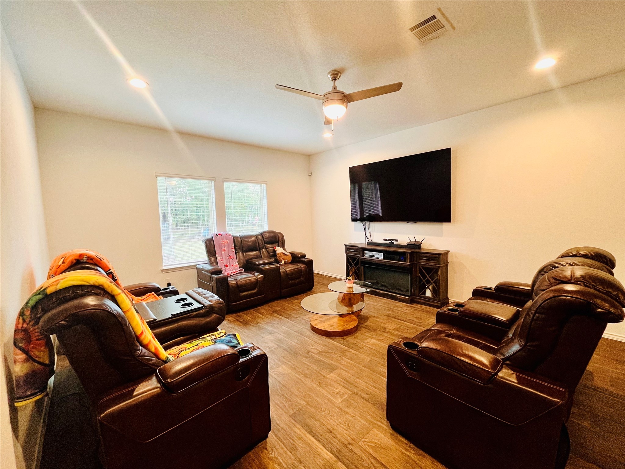 2914 Roman Forest Boulevard New Caney, TX 77357 - Photo 12 of 35 a living room with furniture and a flat screen tv