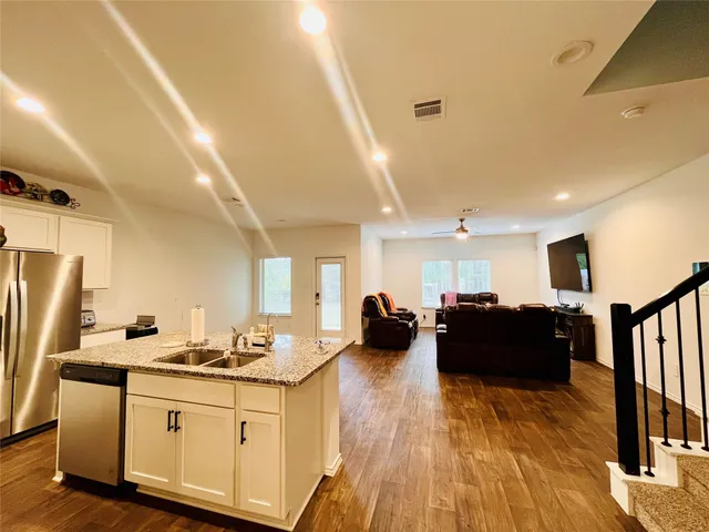 a view of kitchen with sink microwave and stove