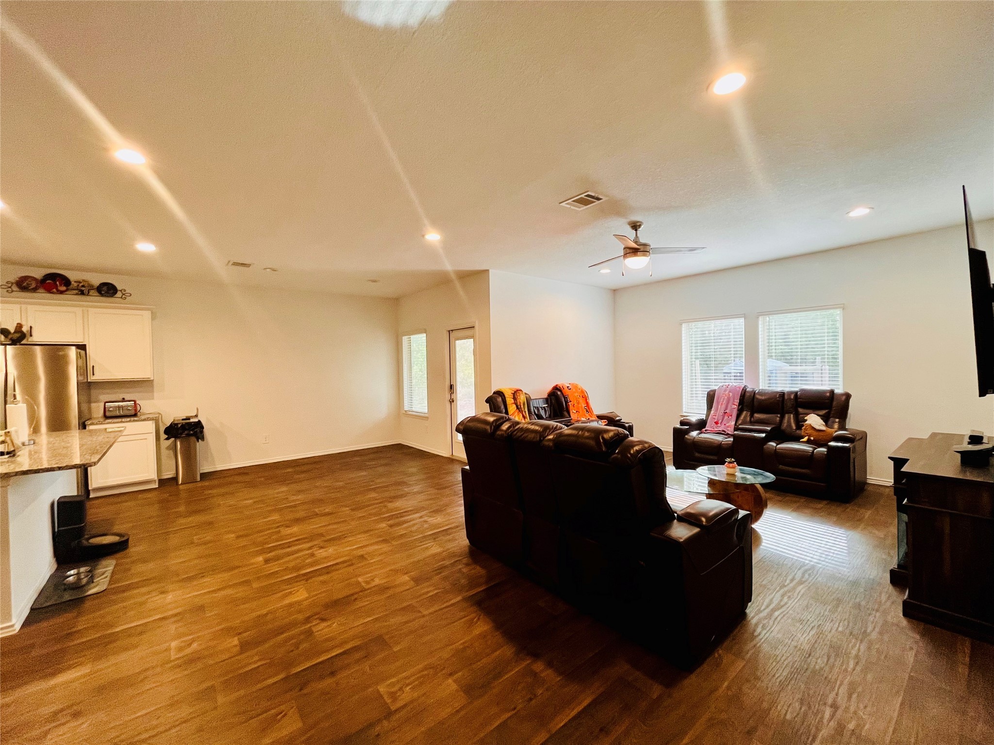 2914 Roman Forest Boulevard New Caney, TX 77357 - Photo 15 of 35 a living room with furniture and a wooden floor