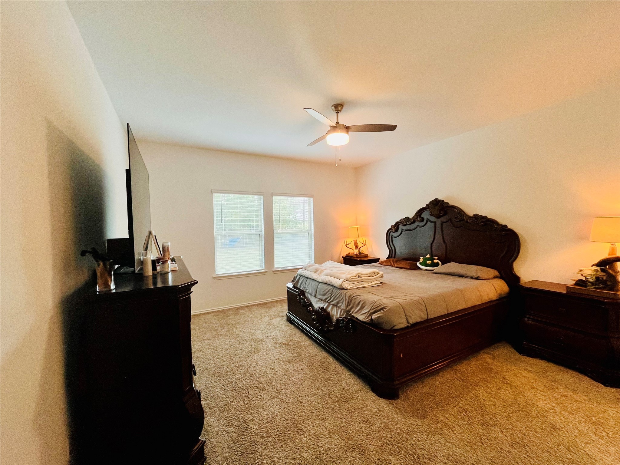 2914 Roman Forest Boulevard New Caney, TX 77357 - Photo 19 of 35 a bedroom with a bed window and dresser