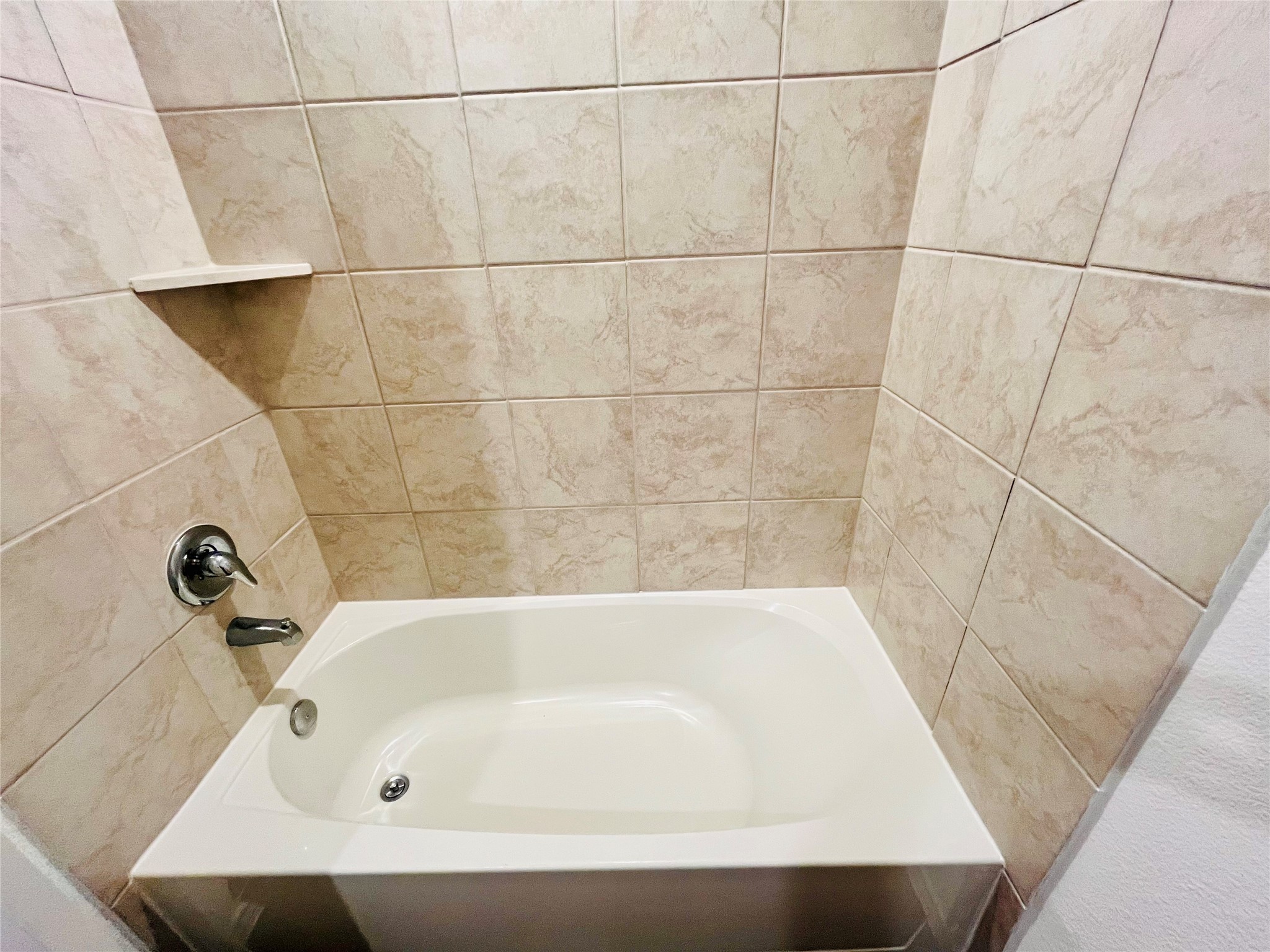 2914 Roman Forest Boulevard New Caney, TX 77357 - Photo 24 of 35 a bathroom with a bathtub