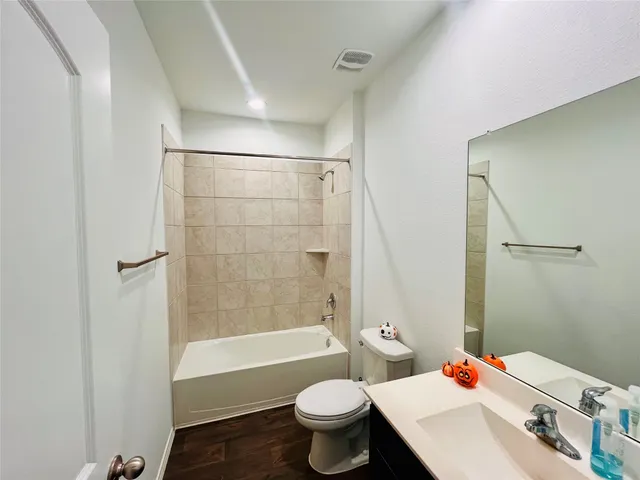 a bathroom with a sink a mirror and a bathtub