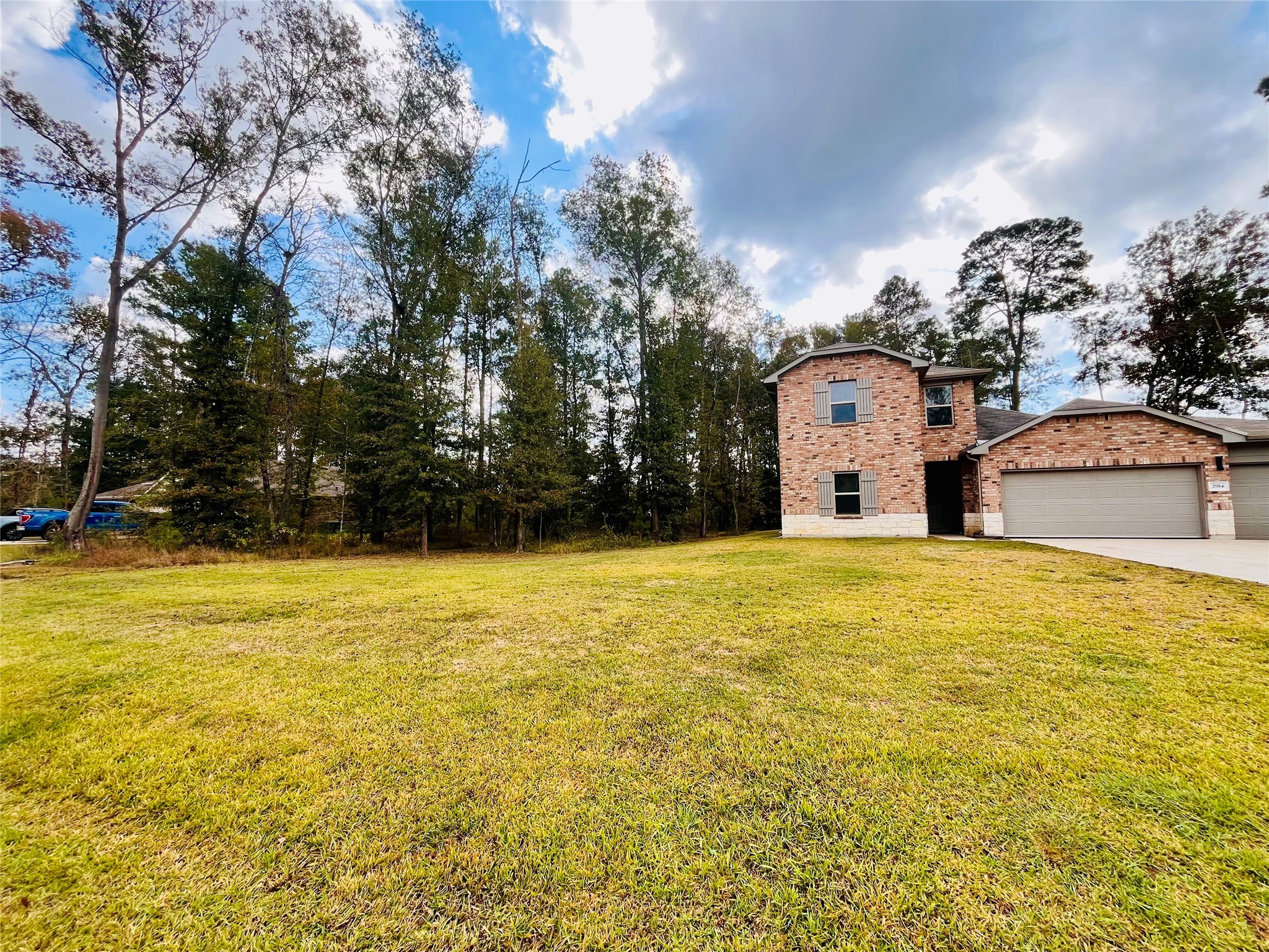 2914 Roman Forest Boulevard New Caney, TX 77357 - Photo 3 of 35 a house view with a swimming pool