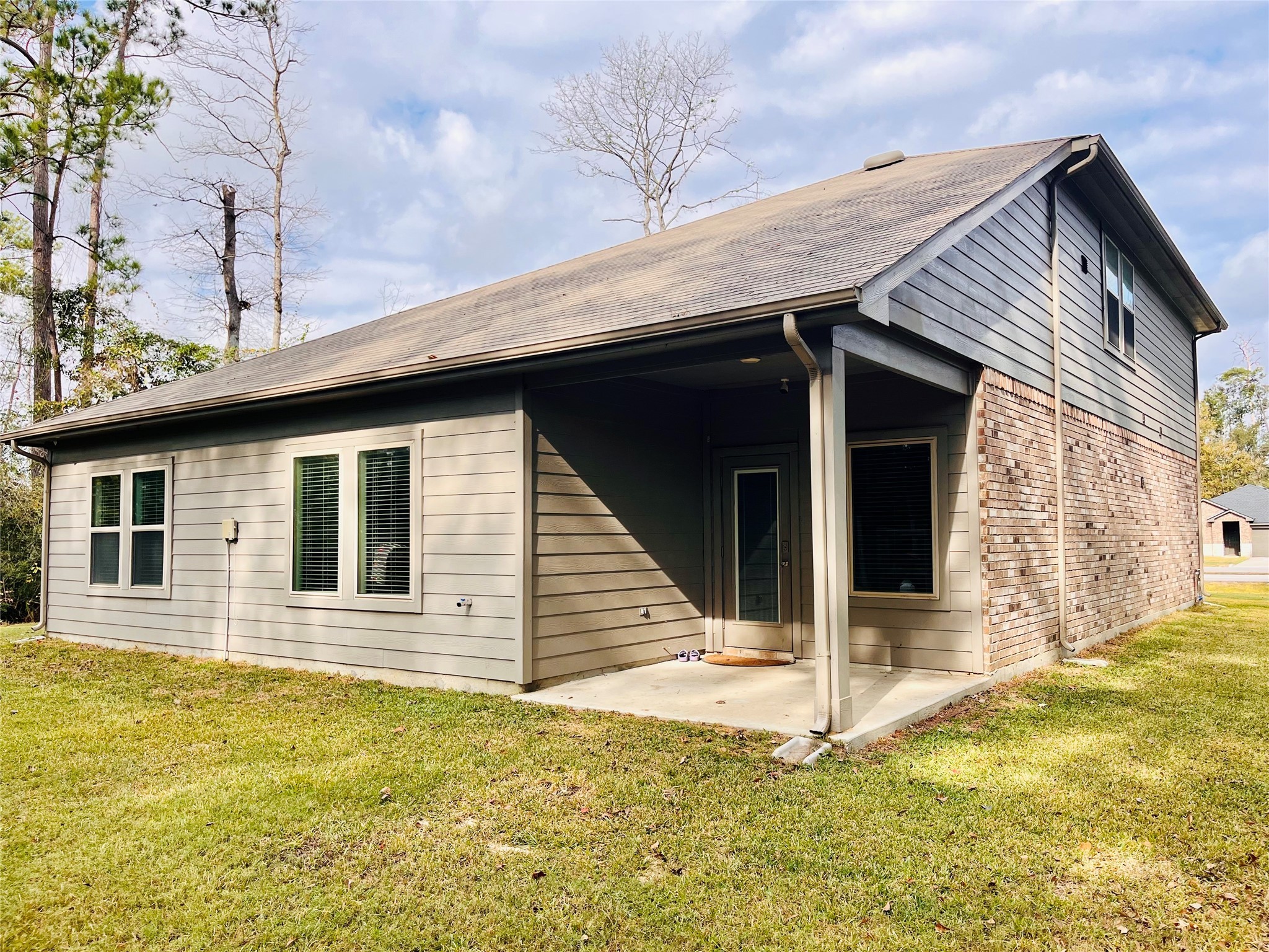 2914 Roman Forest Boulevard New Caney, TX 77357 - Photo 5 of 35 a front view of a house with a yard