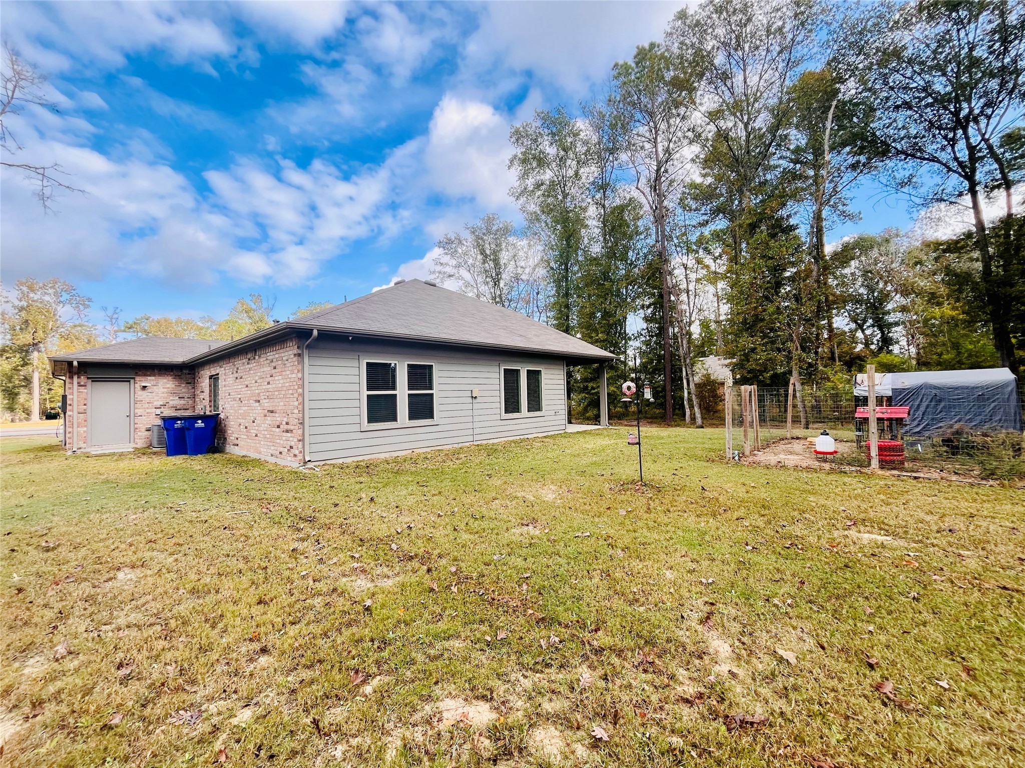 2914 Roman Forest Boulevard New Caney, TX 77357 - Photo 6 of 35 a front view of house with yard and trees