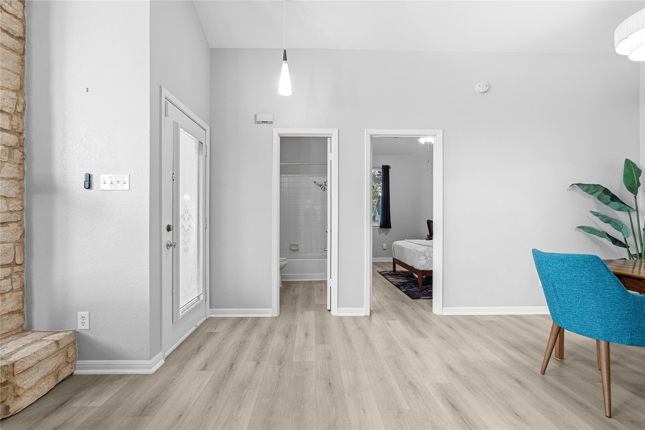 6501 Brush Country Road, Unit 137 Austin, TX 78749 - Photo 24 of 34 a hallway with wooden floor and furniture