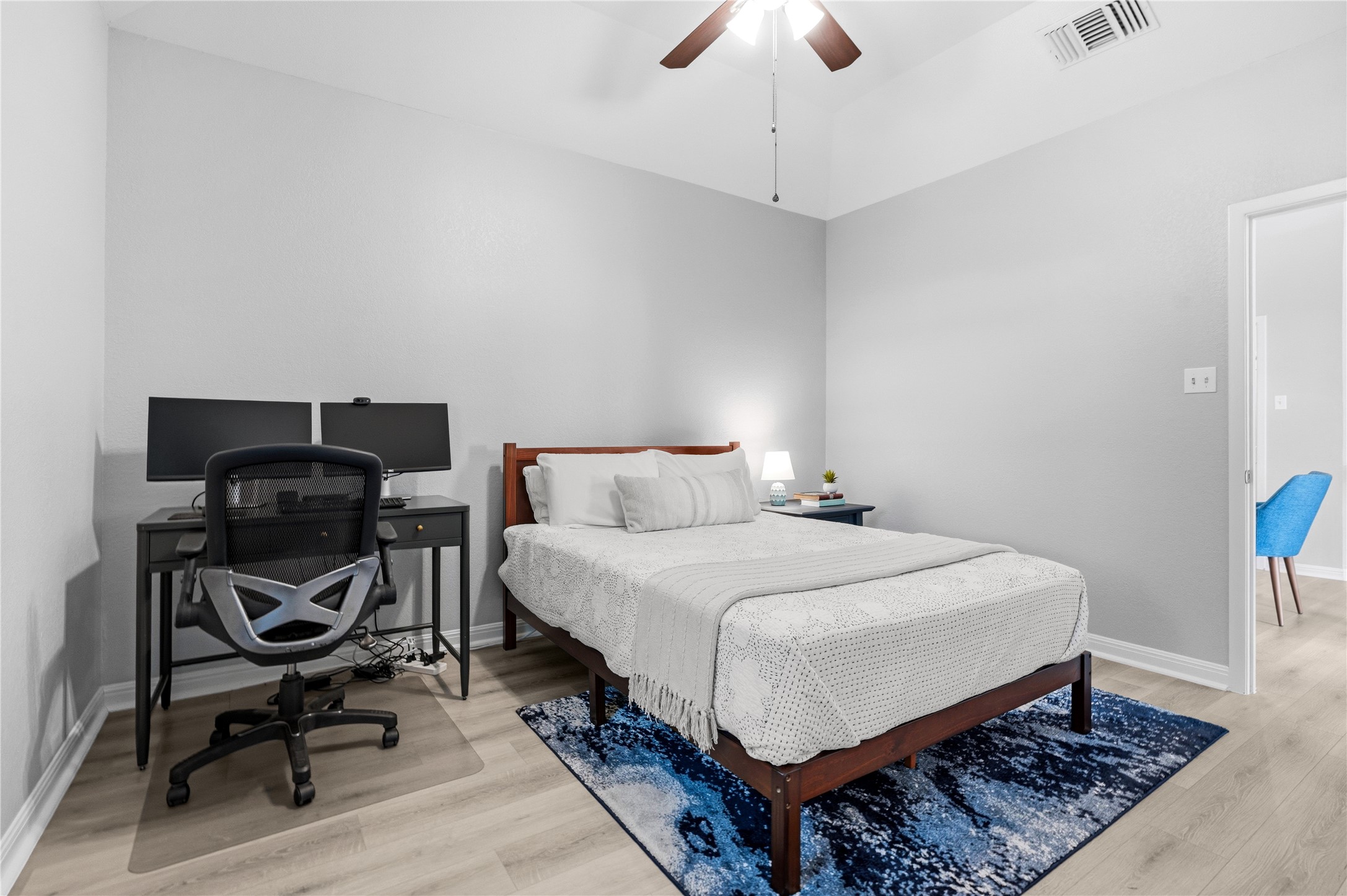 6501 Brush Country Road, Unit 137 Austin, TX 78749 - Photo 26 of 34 a bed room with a bed and a chair