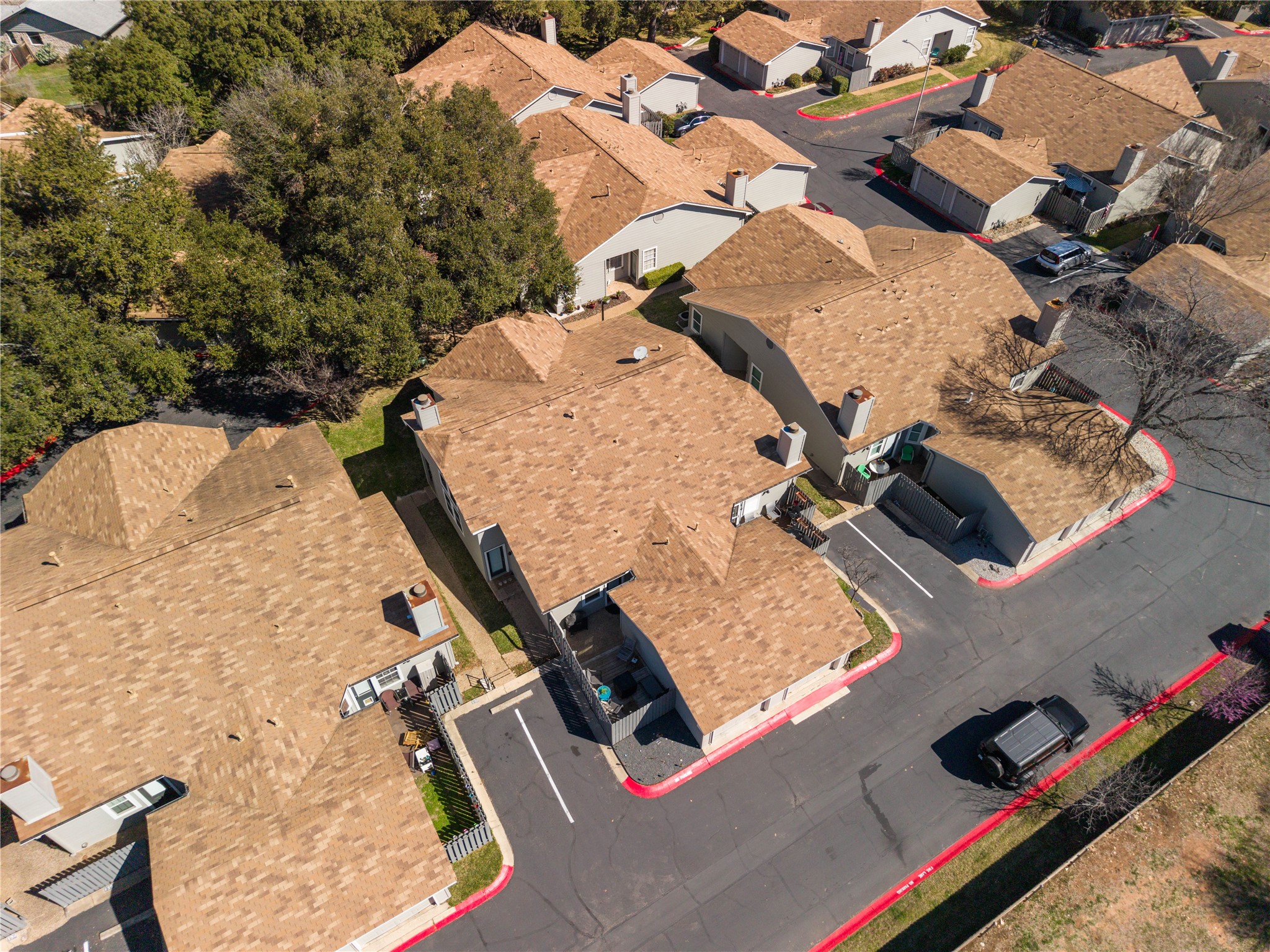 6501 Brush Country Road, Unit 137 Austin, TX 78749 - Photo 33 of 34 an aerial view of a house with swimming pool and large trees
