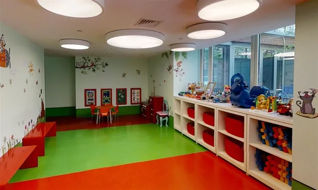 a group of people sitting in a room with chairs