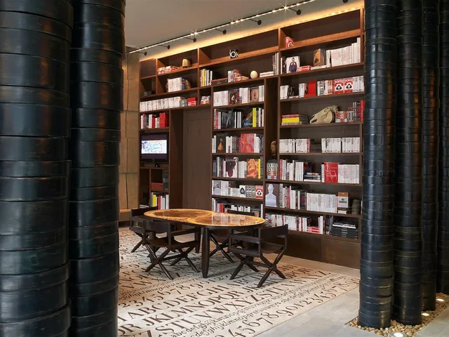 a reading room with furniture and book shelf