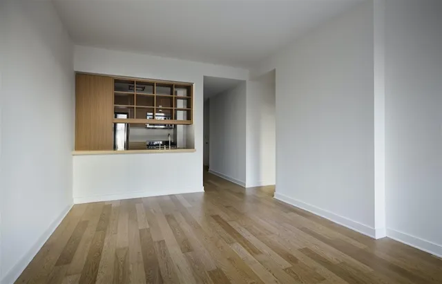 a view of a living room with wooden floor