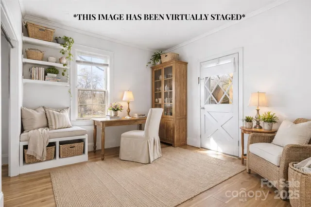 a living room with furniture a fireplace and a table