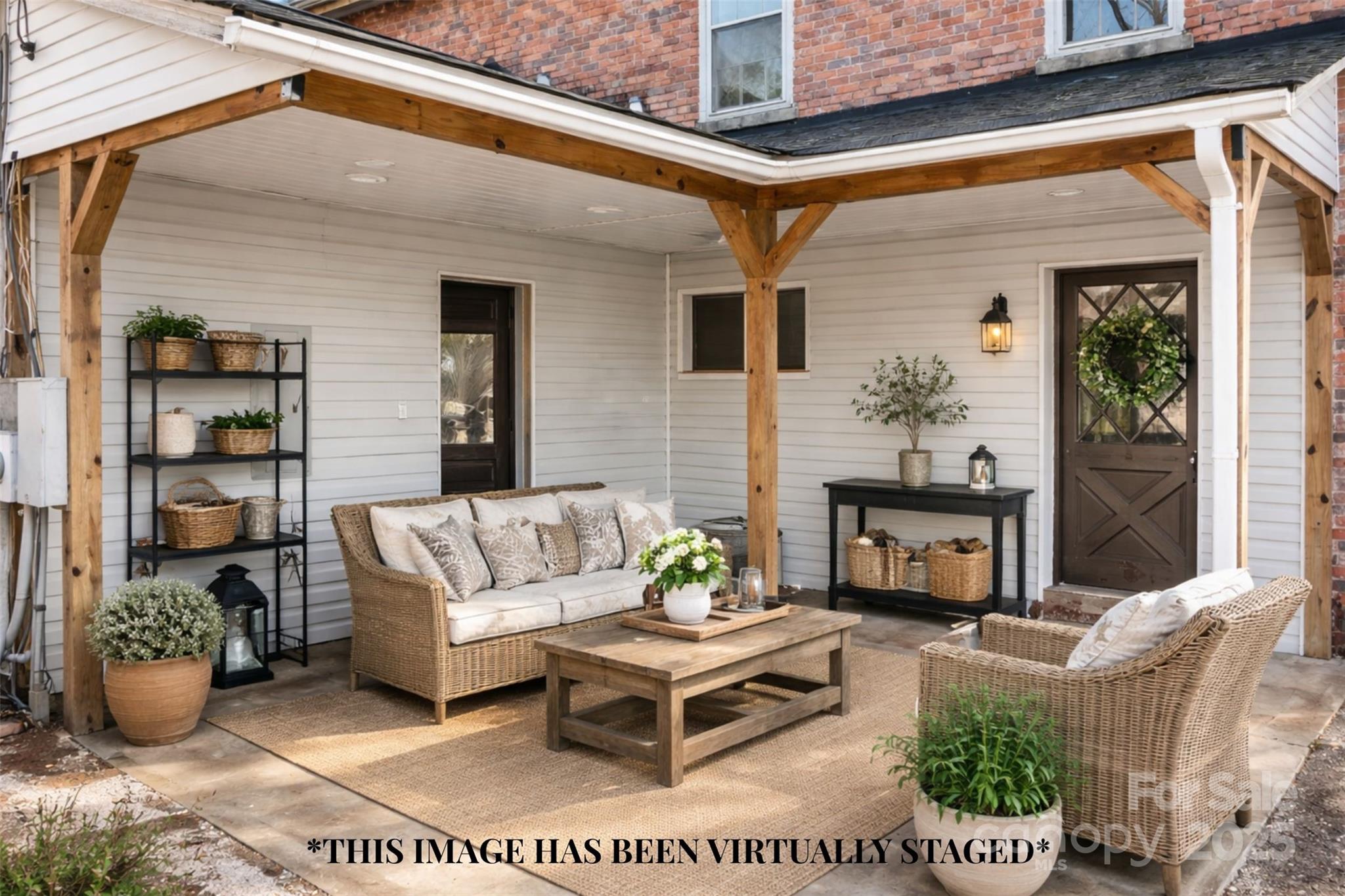 787 Startown Road Lincolnton, NC 28092 - Photo 27 of 33 a view of a patio with couches table and chairs and potted plants
