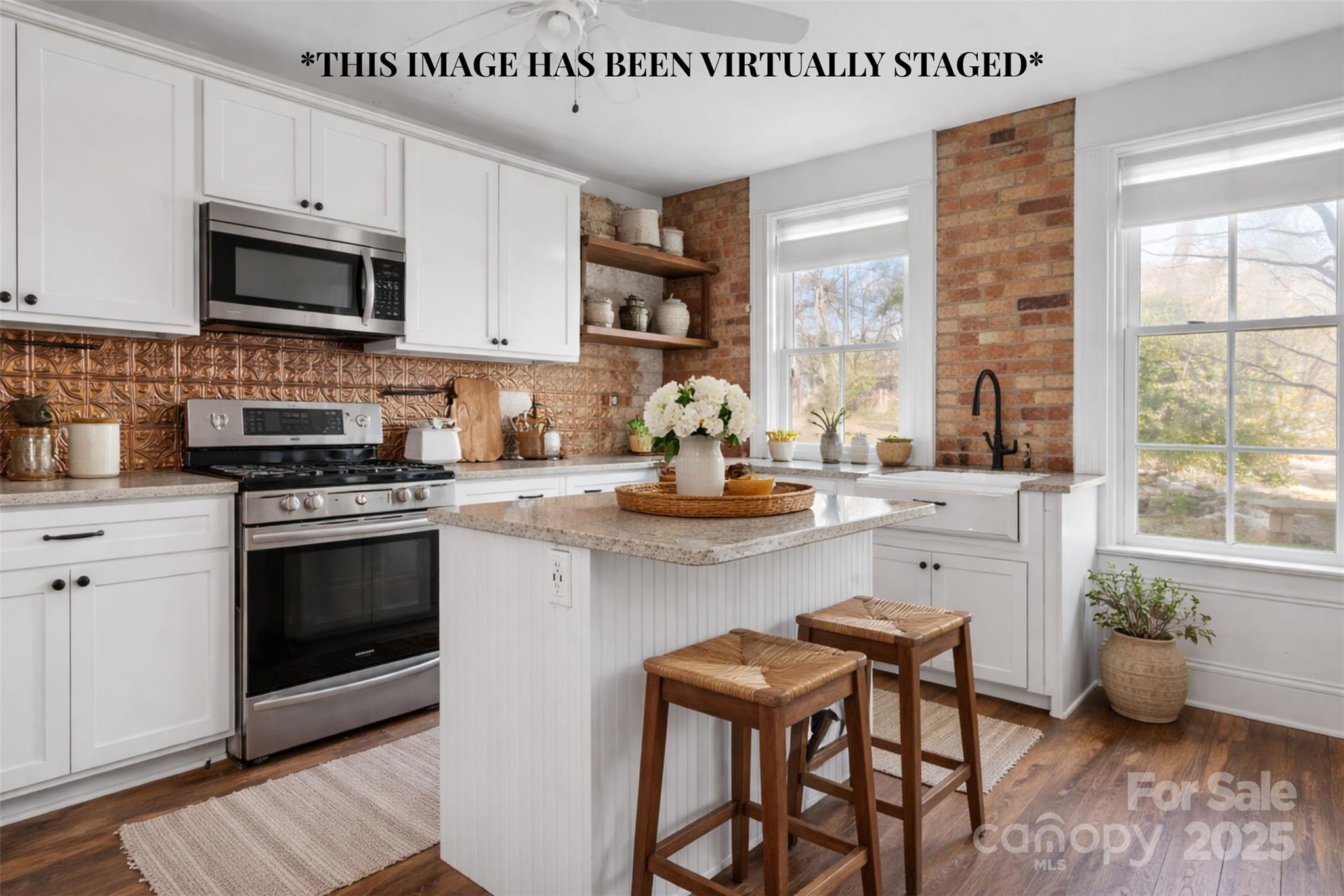 787 Startown Road Lincolnton, NC 28092 - Photo 3 of 33 a kitchen with a stove a sink and a microwave