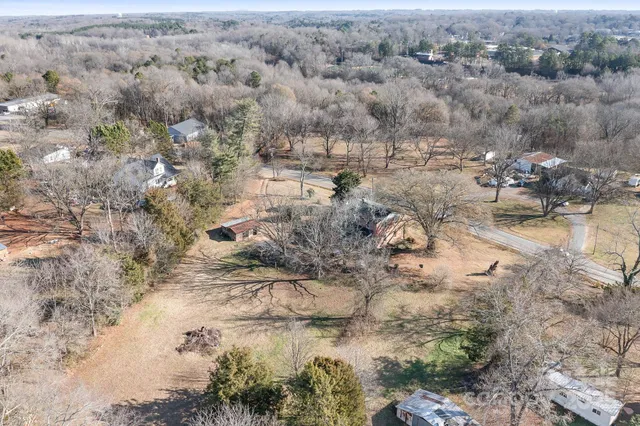 a view of empty space with wooden fence