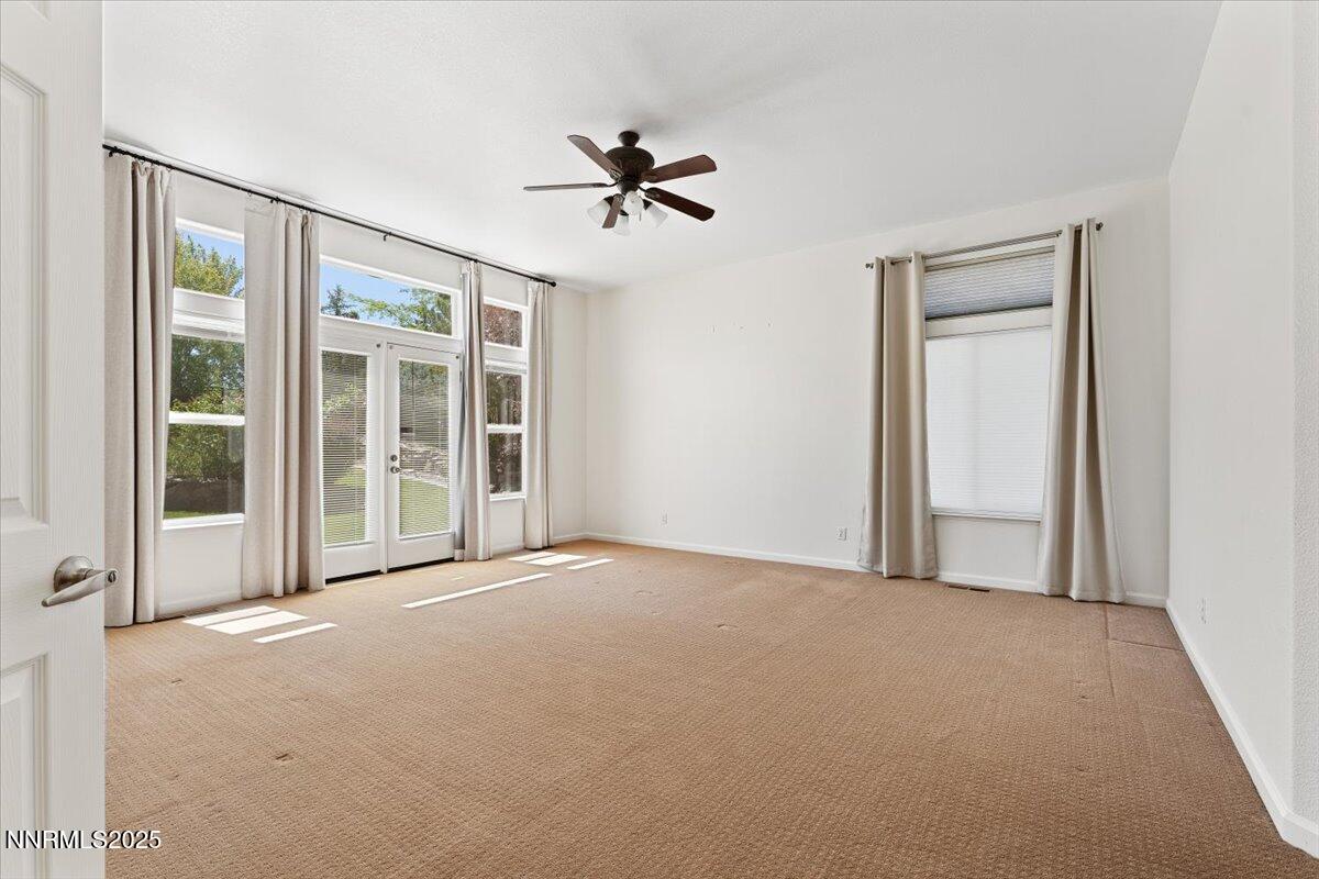 5024 East Albuquerque Road Reno, NV 89511 - Photo 14 of 27 a view of a livingroom with a ceiling fan and window