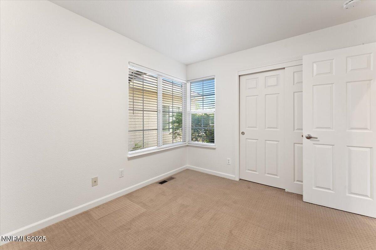 5024 East Albuquerque Road Reno, NV 89511 - Photo 18 of 27 an empty room with windows