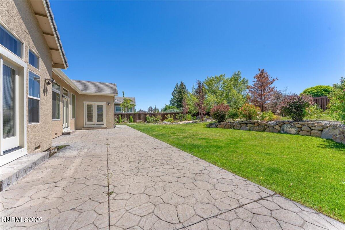5024 East Albuquerque Road Reno, NV 89511 - Photo 22 of 27 a view of a house with a yard