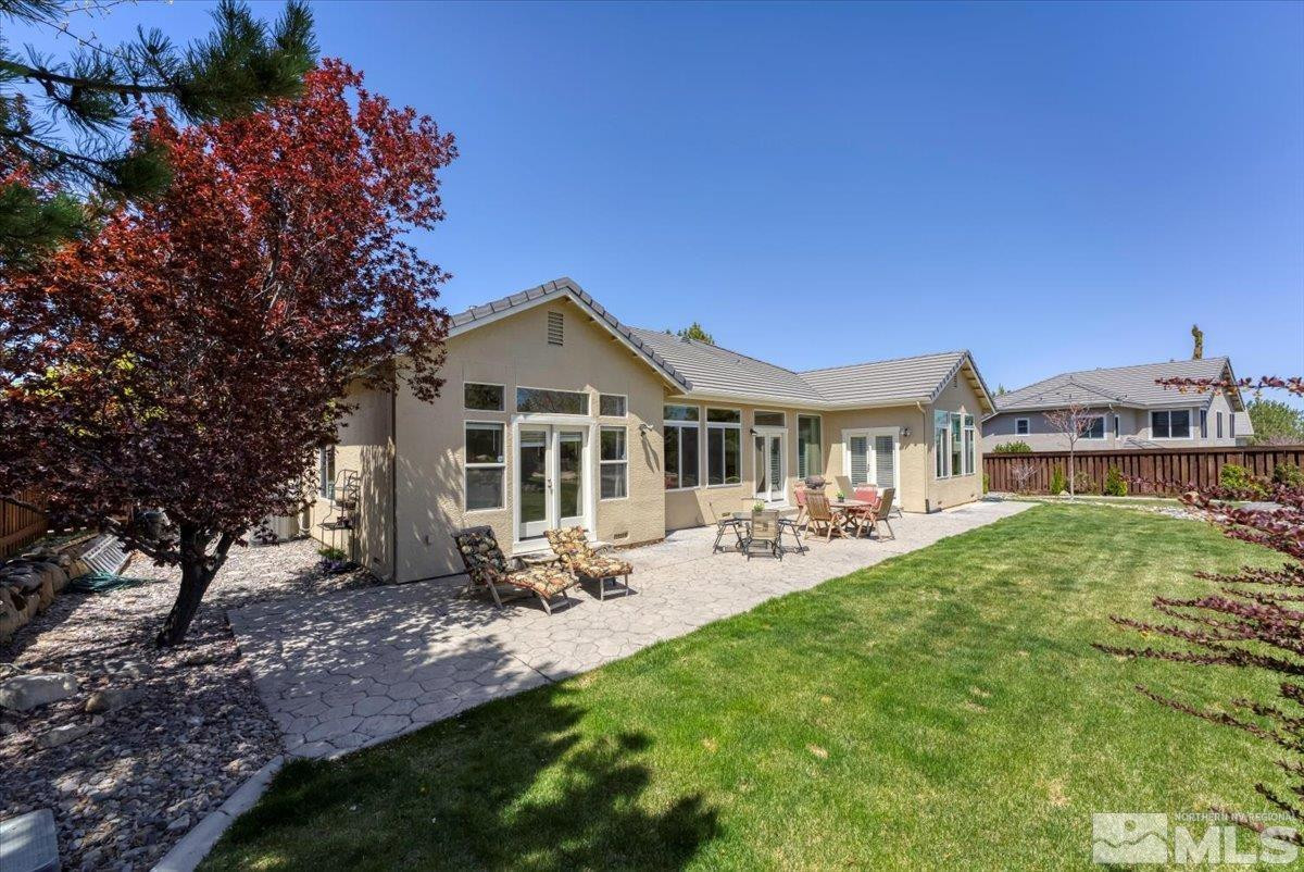 5024 East Albuquerque Road Reno, NV 89511 - Photo 23 of 27 a view of a house with backyard porch and sitting area
