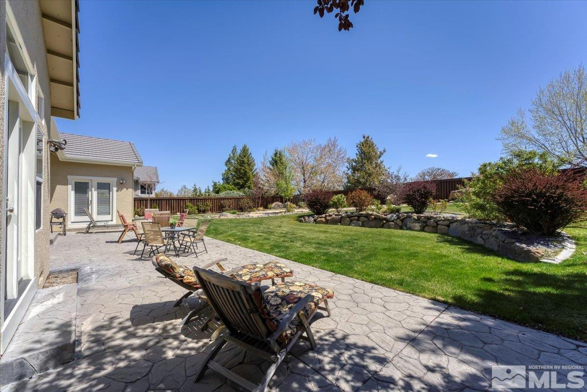 5024 East Albuquerque Road Reno, NV 89511 - Photo 25 of 27 a view of a backyard with sitting area
