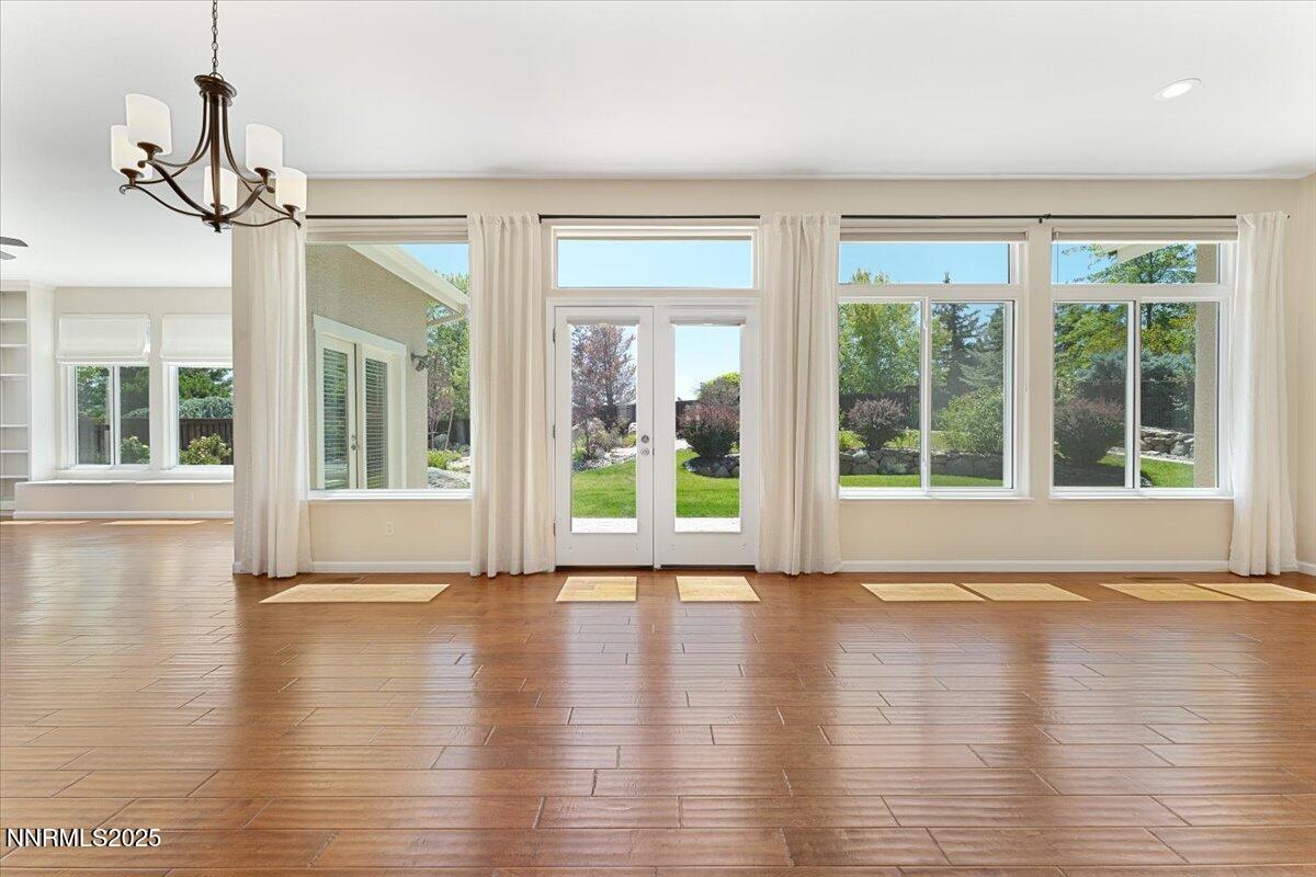 5024 East Albuquerque Road Reno, NV 89511 - Photo 4 of 27 a view of room with wooden floor and windows