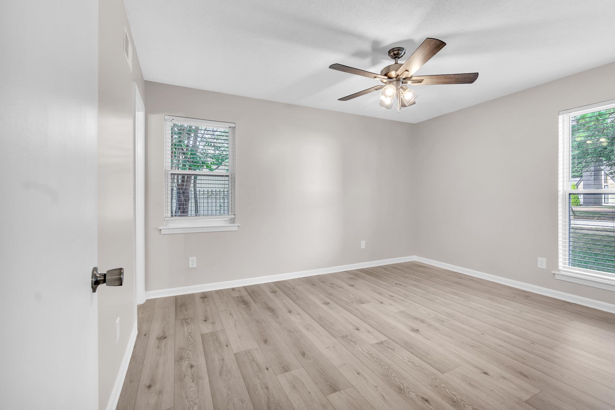 2556 Lynnfield Road Memphis, TN 38119 - Photo 4 of 24 Empty room featuring light wood-style floors and ceiling fan
