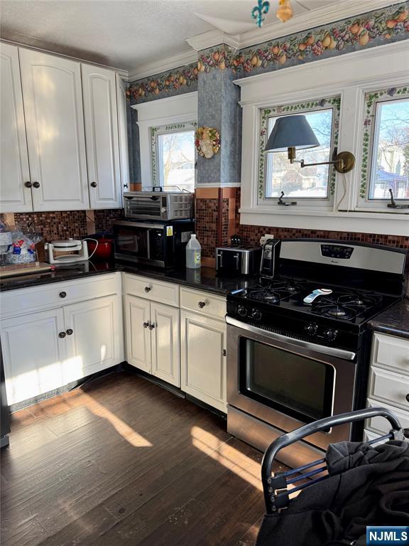 4566 Harding Road Pennsauken, NJ 08109 - Photo 4 of 18 a kitchen with a sink stove and cabinets