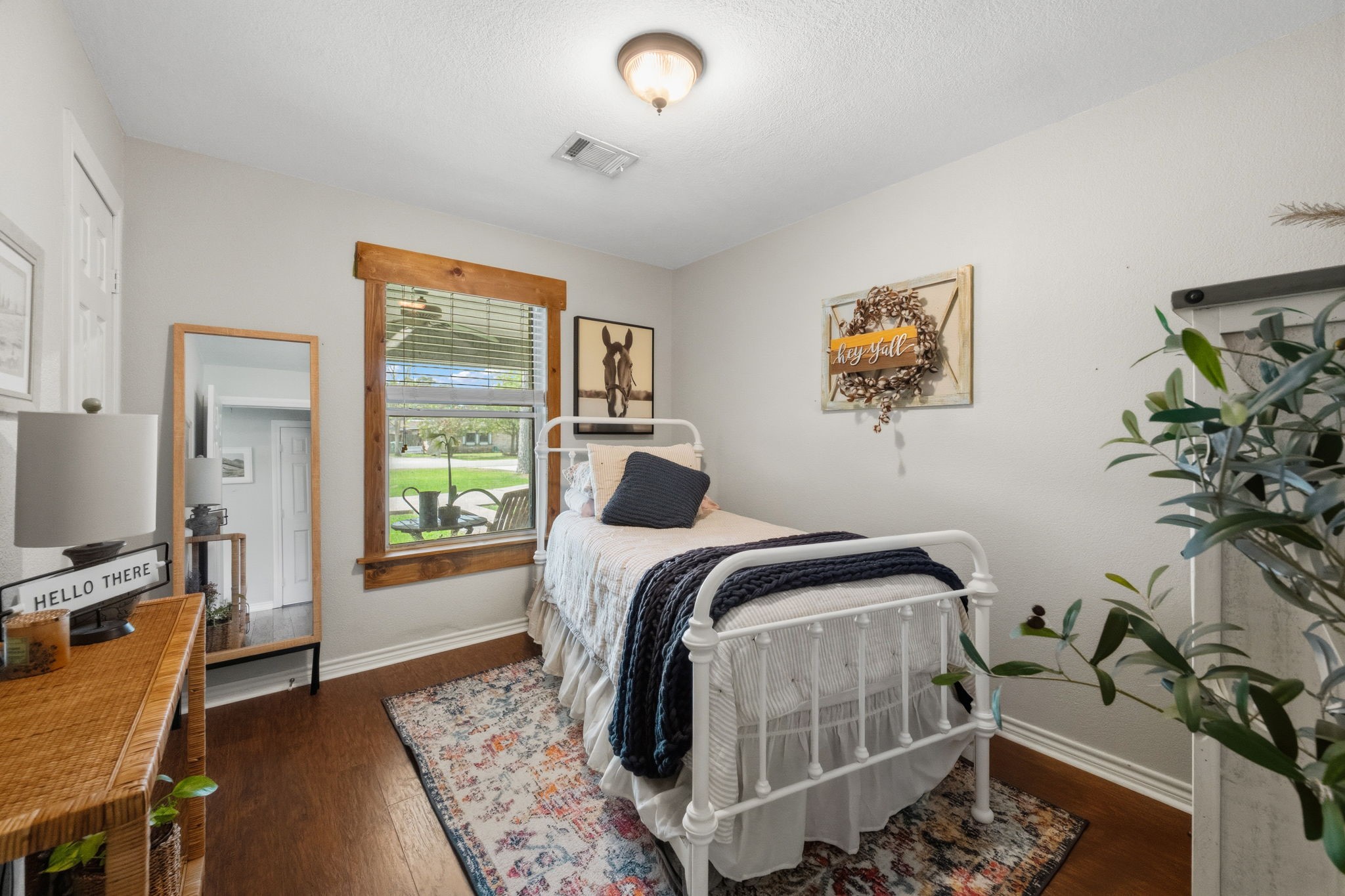 431 Corydon Drive Houston, TX 77336 - Photo 21 of 26 Comfortable secondary bedroom with warm laminate wood floors and soft natural light, creating a peaceful and relaxing environment.