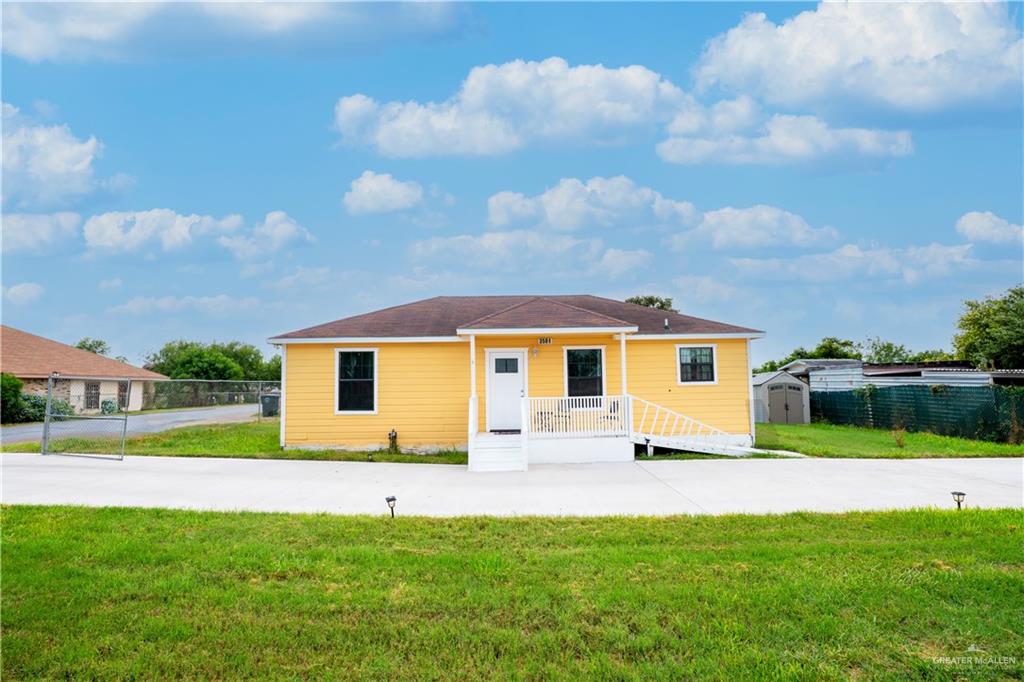 3501 North Stewart Road Mission, TX 78573 - Photo 1 of 1 View of front of home with an outbuilding and a front lawn