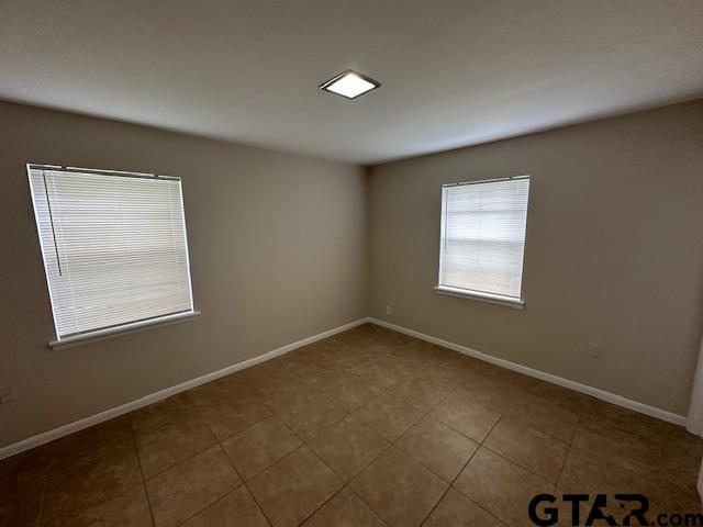 3023 Mistletoe Circle Tyler, TX 75701 - Photo 6 of 14 an empty room with a window
