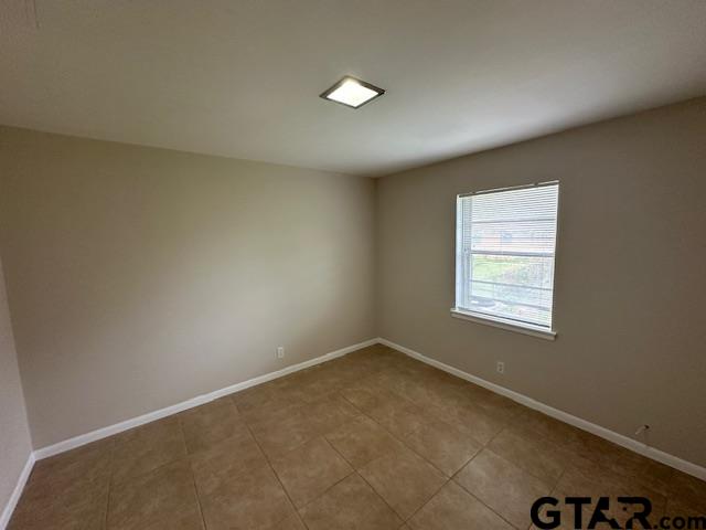 3023 Mistletoe Circle Tyler, TX 75701 - Photo 8 of 14 an empty room with a window