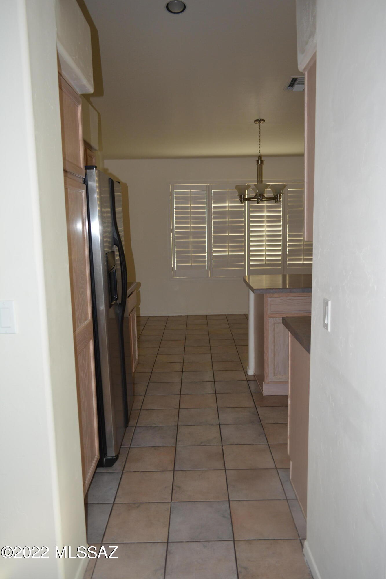 1714 Camino Rivera Rio Rico, AZ 85648 - Photo 22 of 26 a kitchen with kitchen island a counter top space and appliances