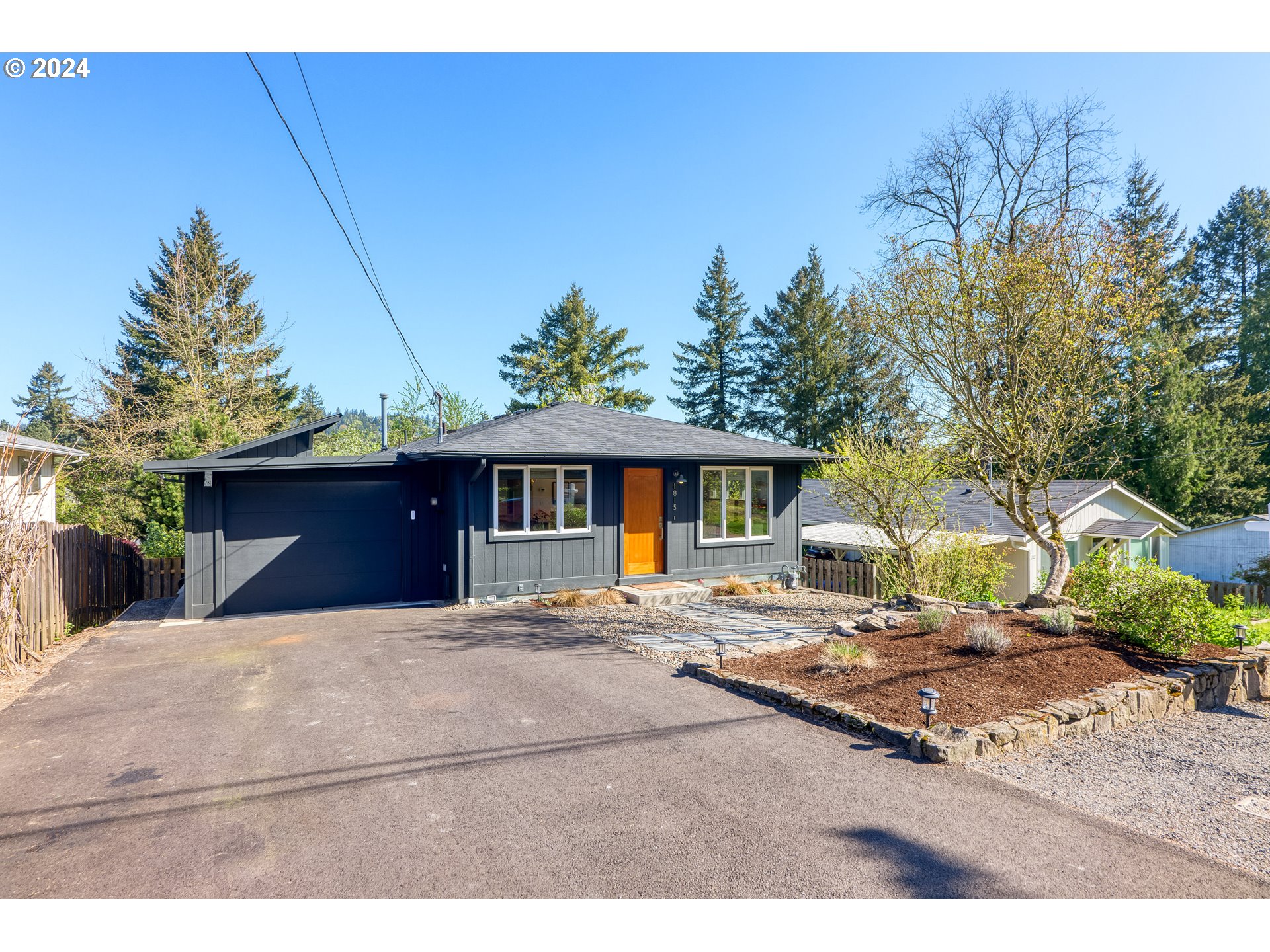 a backyard of a house with yard and outdoor seating