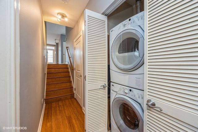 a view of a hallway with washer and dryer