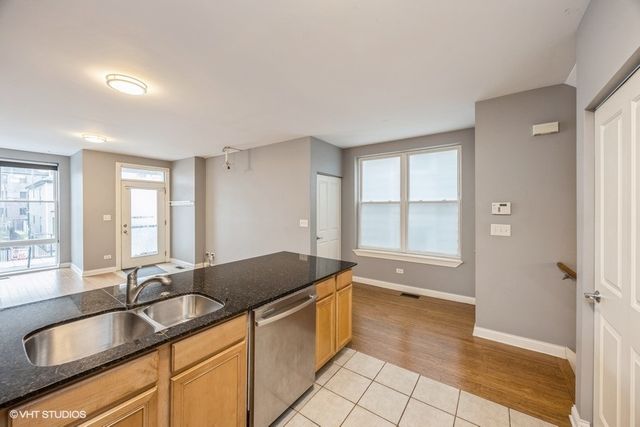 a large bathroom with a granite countertop tub and a sink