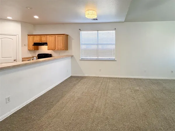 a large kitchen with a large window