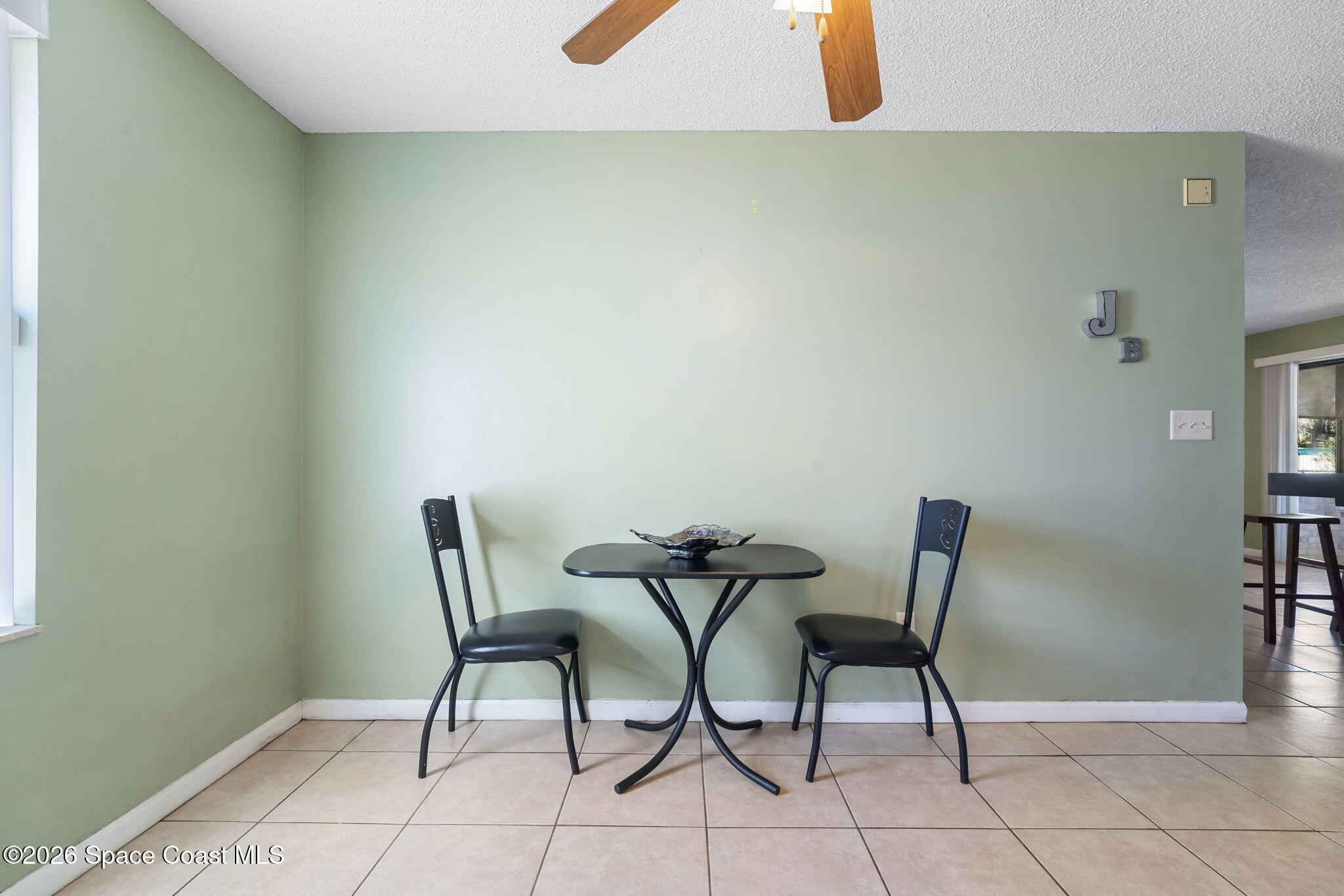 4550 Piedras Street Cocoa, FL 32927 - Photo 11 of 53 a view of a room with furniture and wooden floor