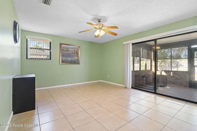 a view of kitchen with stainless steel appliances kitchen island granite countertop a refrigerator and a stove top oven
