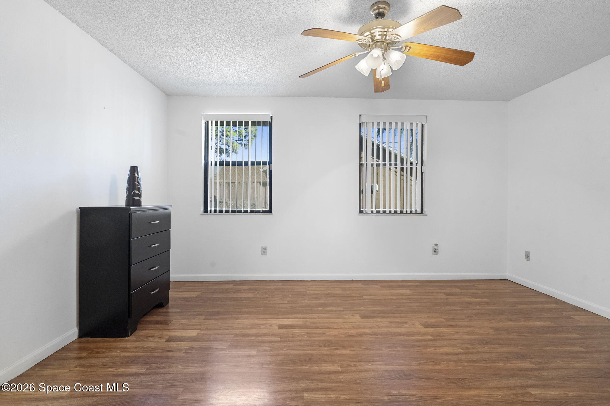 4550 Piedras Street Cocoa, FL 32927 - Photo 18 of 53 wooden floor in an empty room with a window