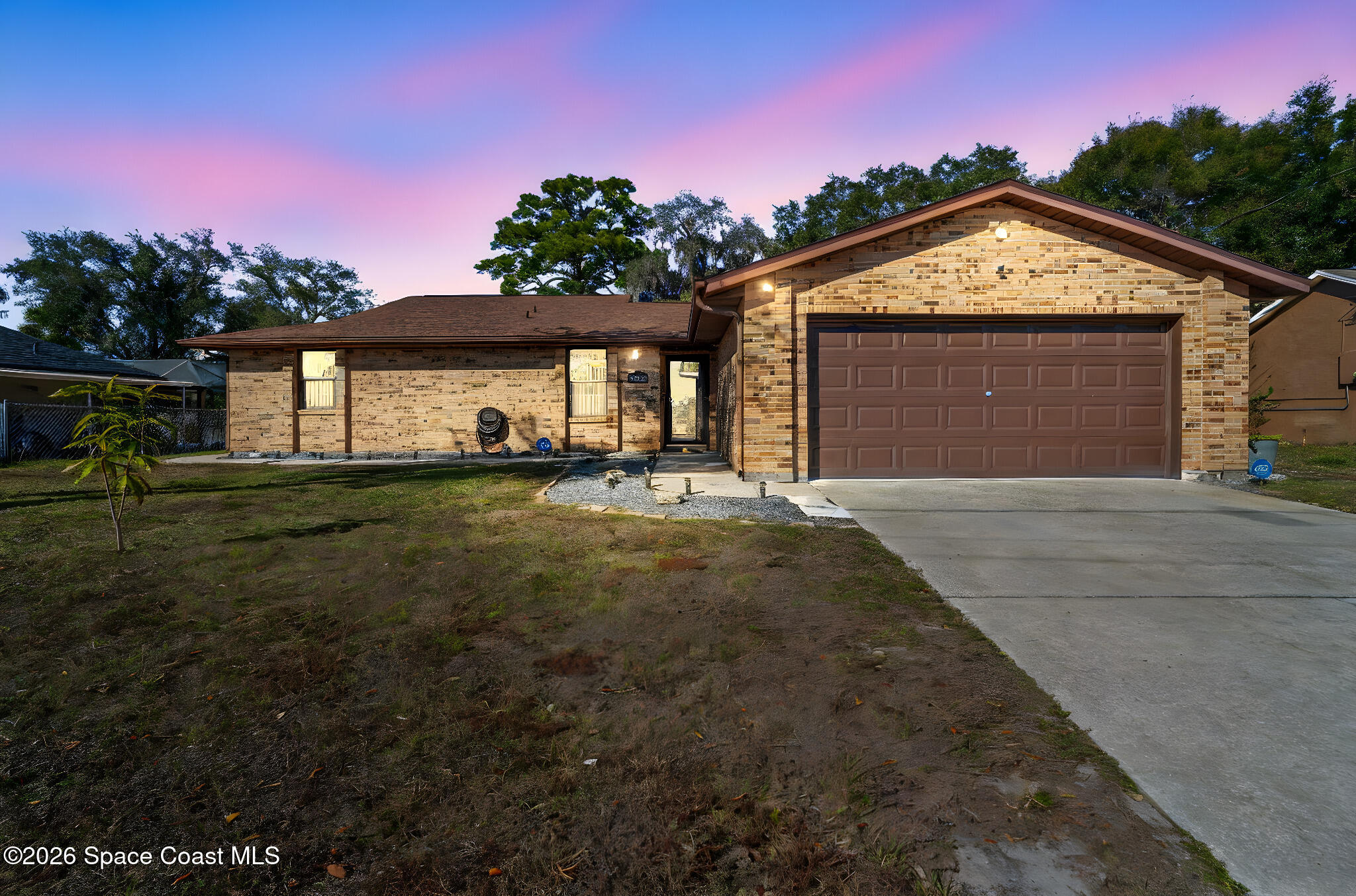 4550 Piedras Street Cocoa, FL 32927 - Photo 2 of 53 a front view of a house with a yard