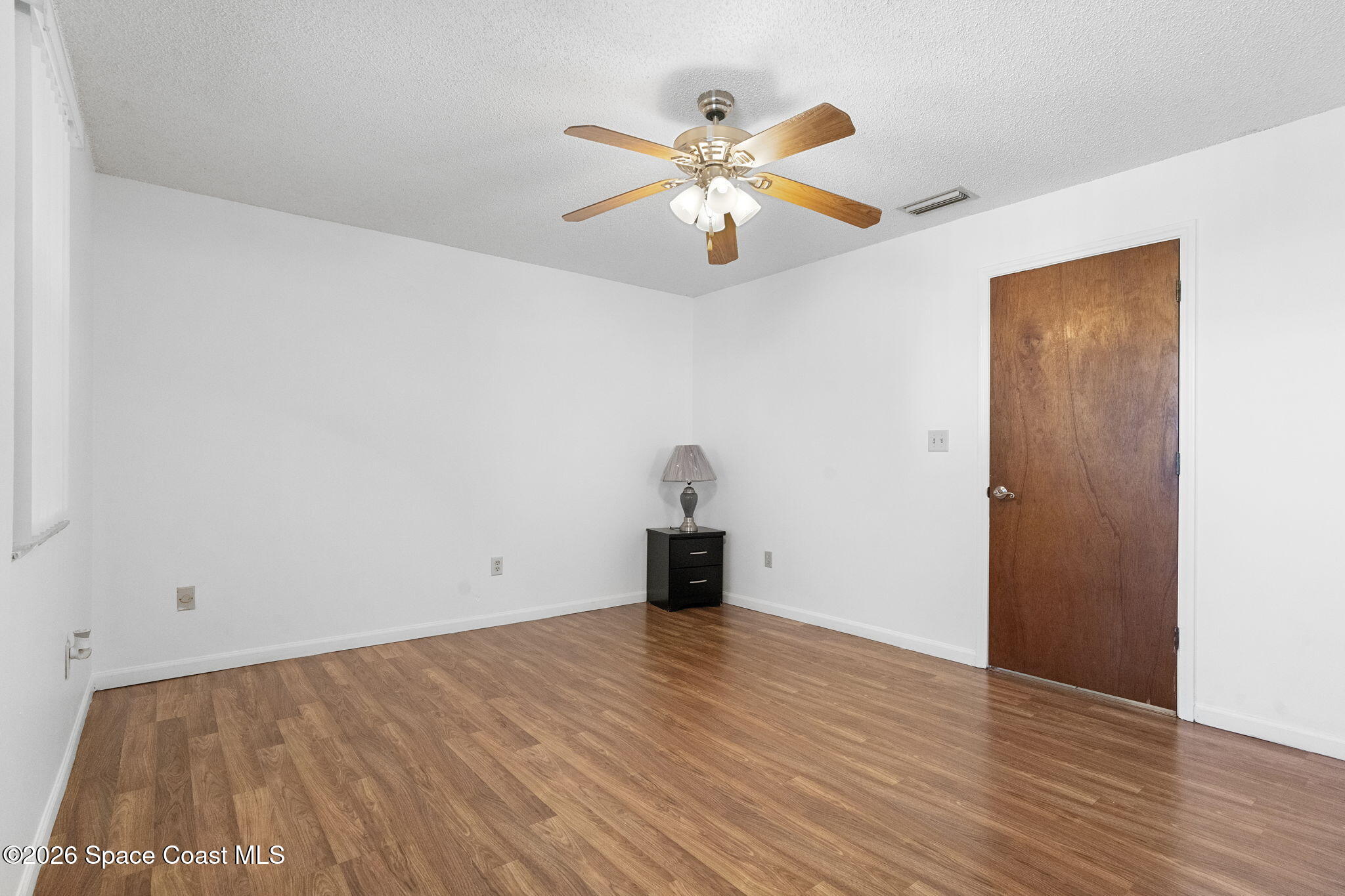 4550 Piedras Street Cocoa, FL 32927 - Photo 21 of 53 a view of empty room with wooden floor