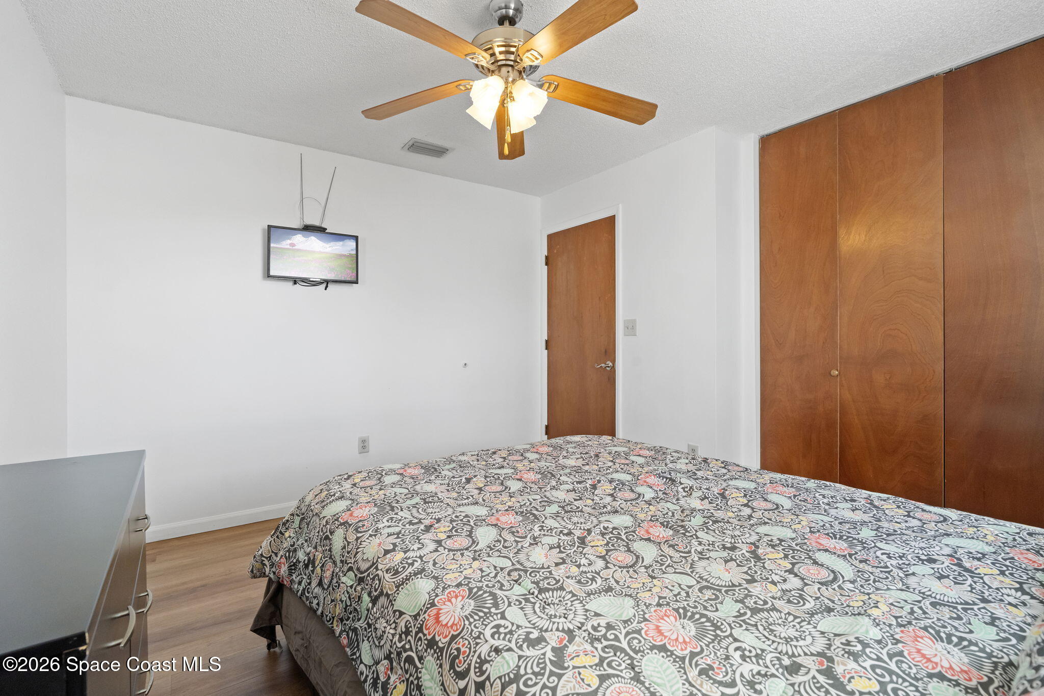 4550 Piedras Street Cocoa, FL 32927 - Photo 29 of 53 a bedroom with a bed and a chandelier
