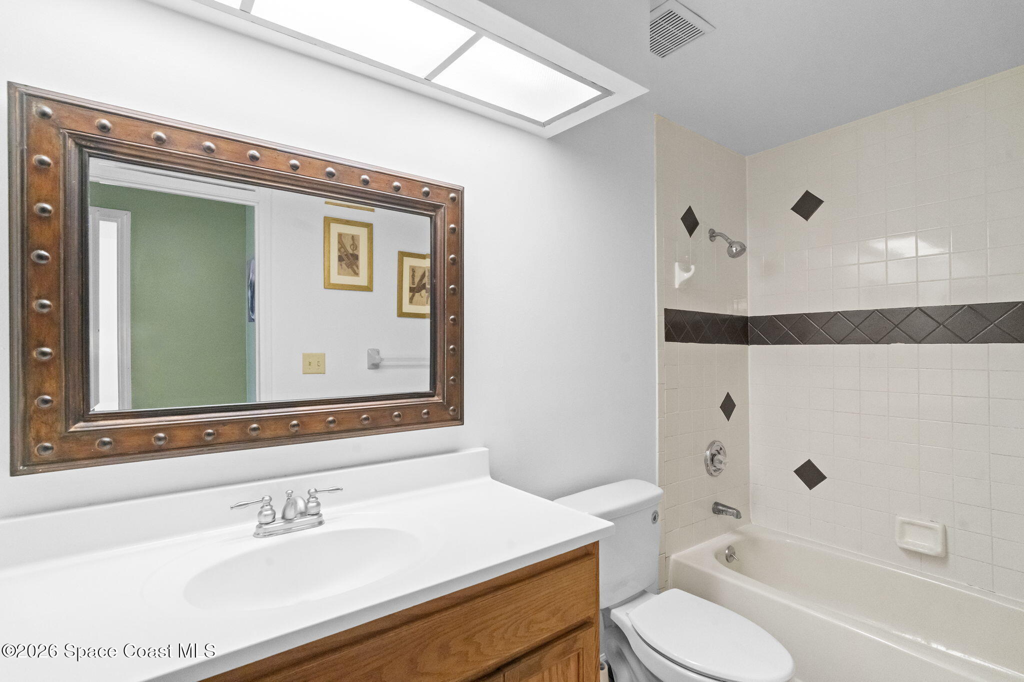 4550 Piedras Street Cocoa, FL 32927 - Photo 30 of 53 a bathroom with a sink a toilet and a bathtub